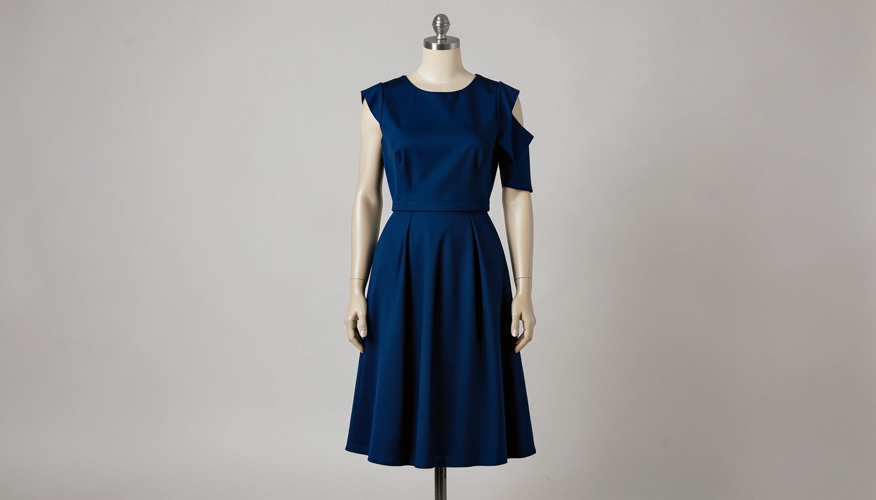 Fashion dress on a mannequin, deep jewel tones against a neutral backdrop
