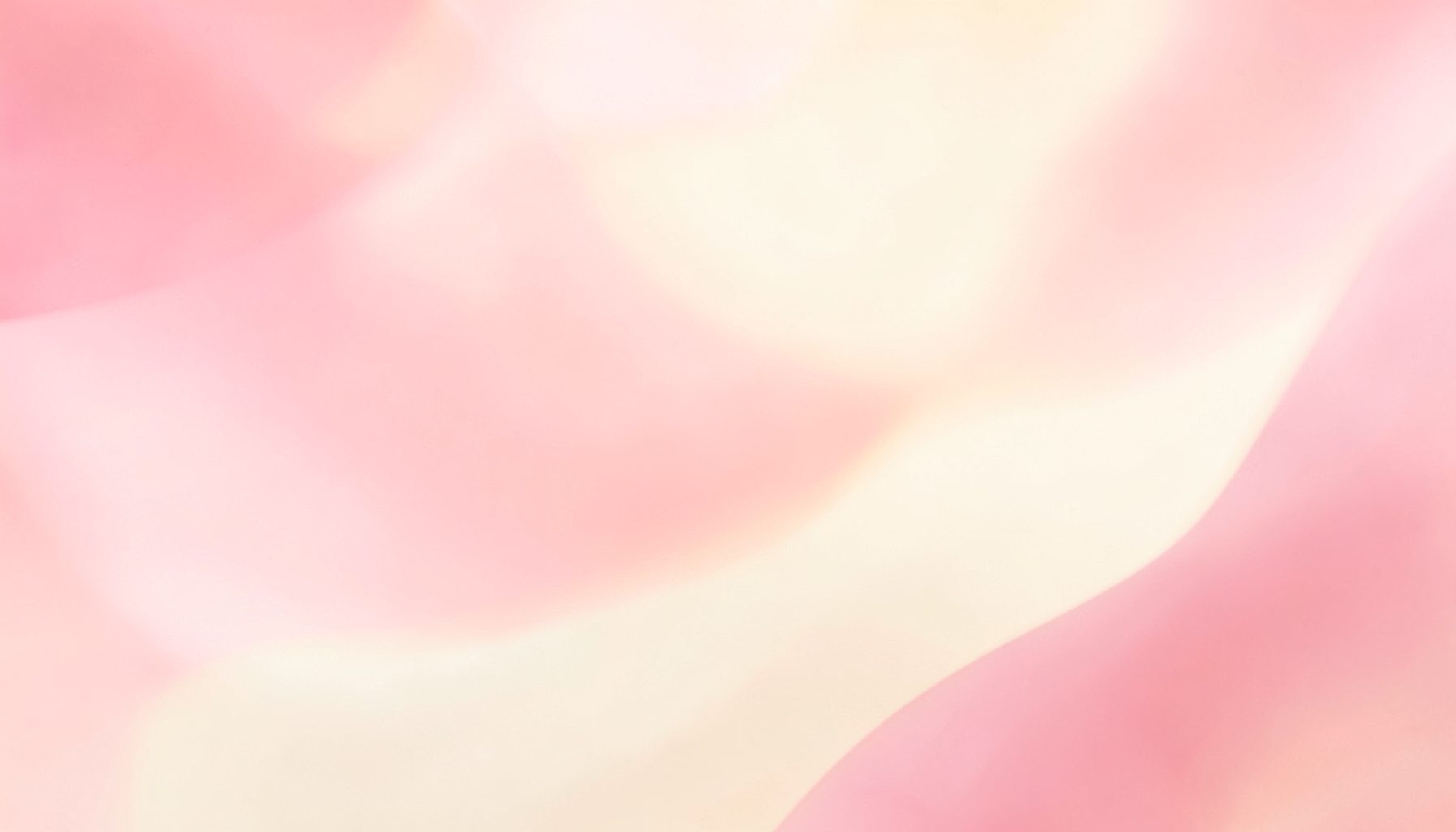 Soft pink and cream abstract backdrop with warm, diffused lighting and a gentle feminine glow